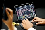person using black tablet computer