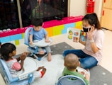 boy in blue t-shirt sitting on floor