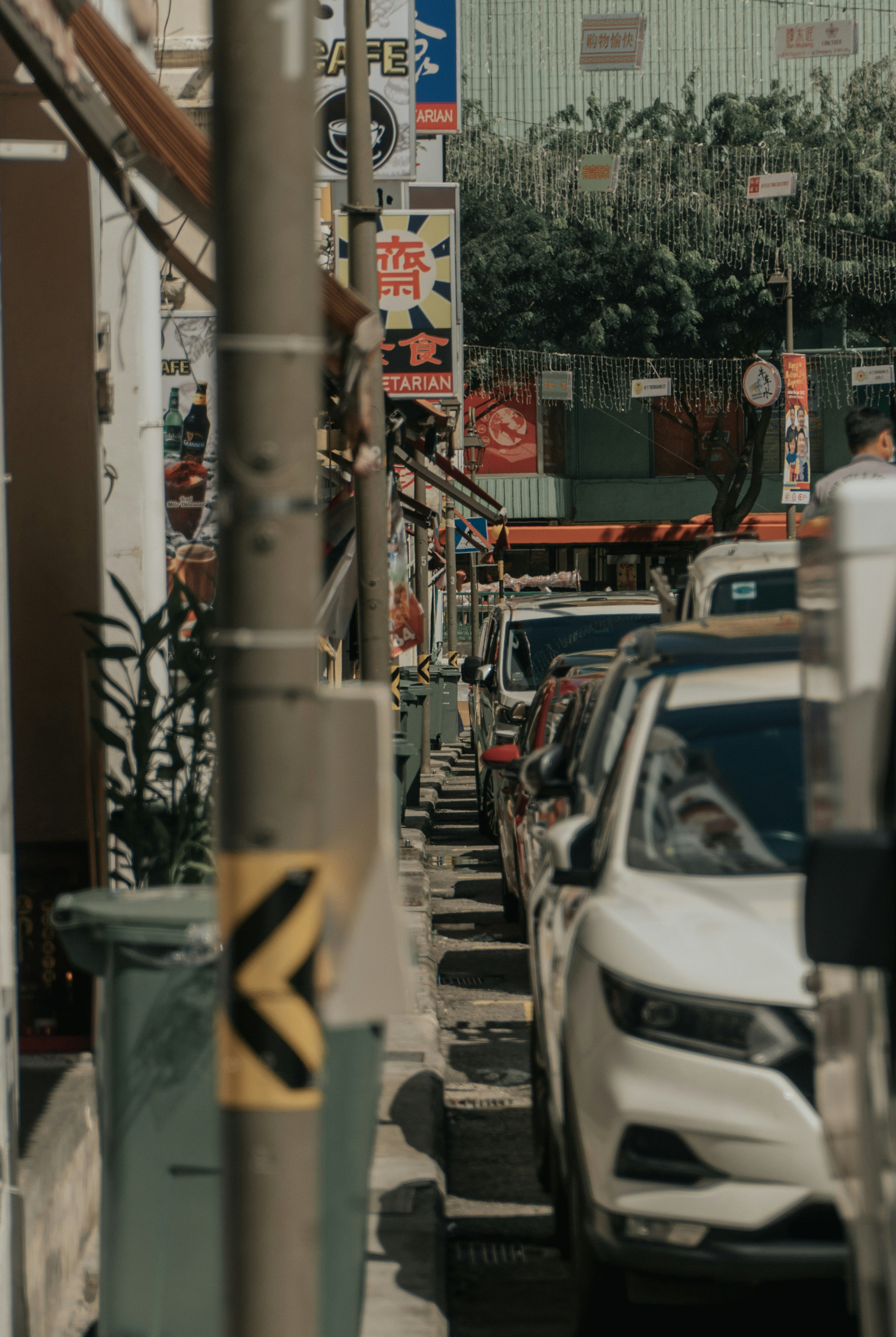 cars parked on side of the road during daytime