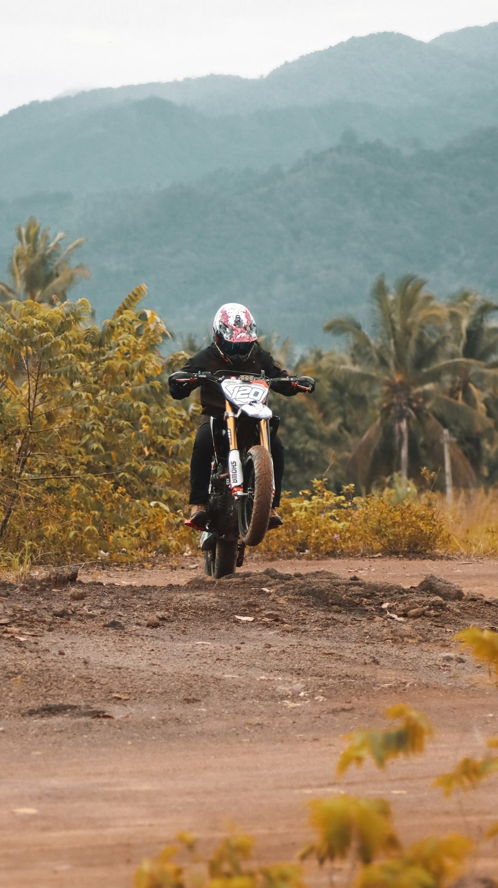 man in black jacket and helmet riding motorcycle