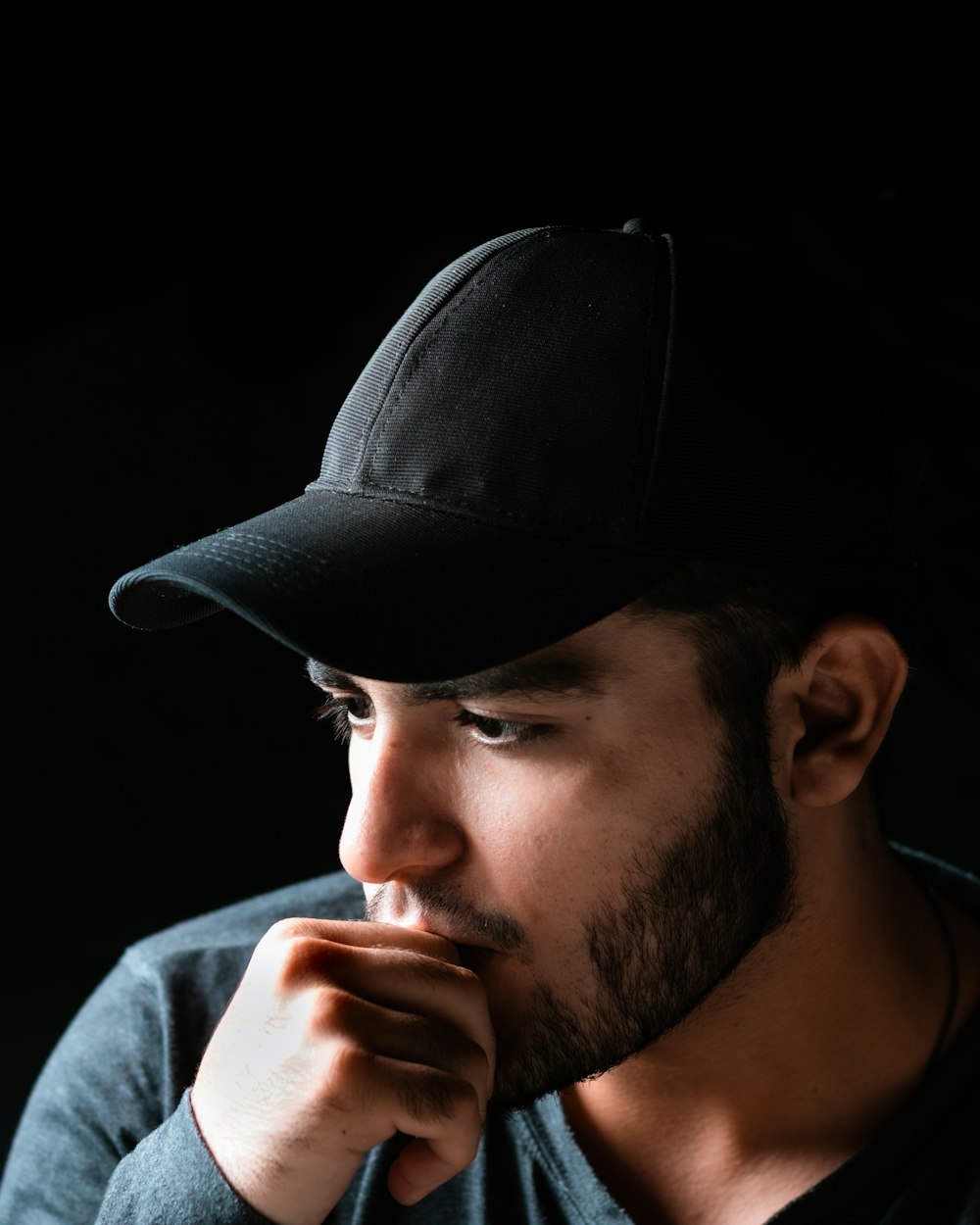 man in black hat and white shirt