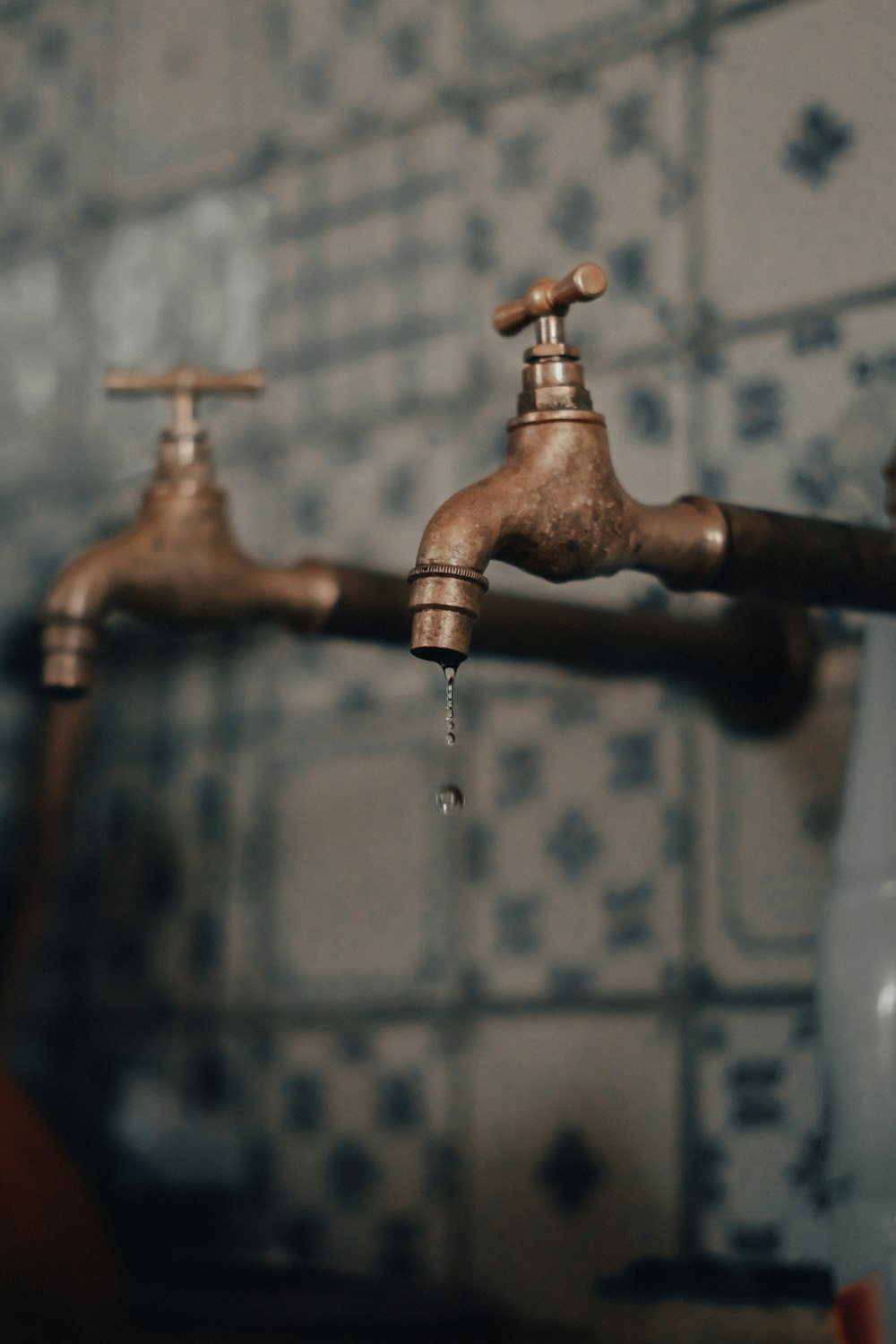 brown wooden water pipe with water drop