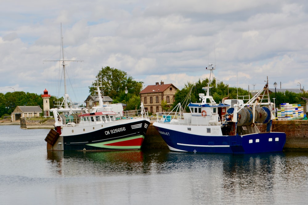 blue and white boat on water during daytime