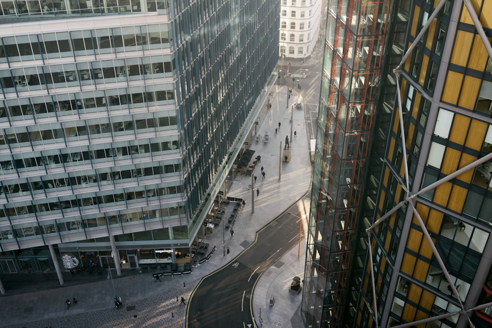 cars on road near high rise buildings during daytime