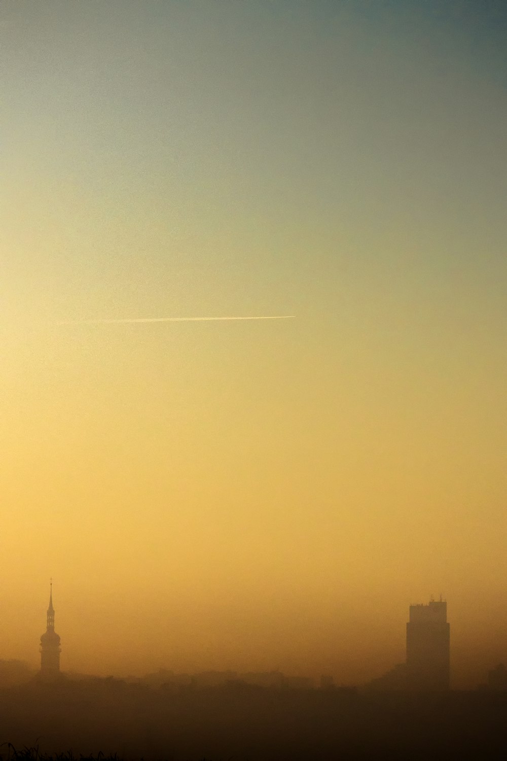 silhouette of building during sunset