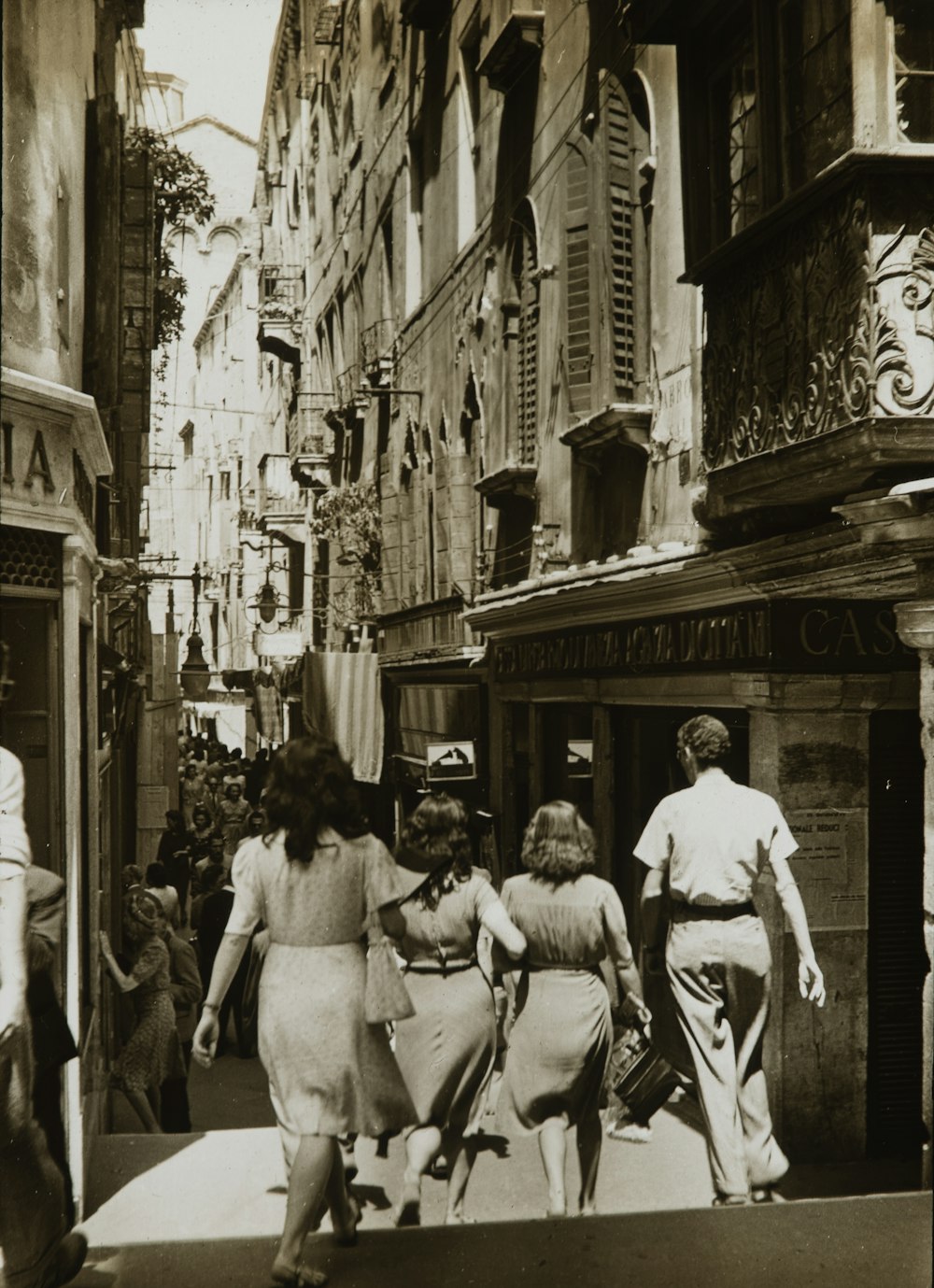 grayscale photo of people walking on street