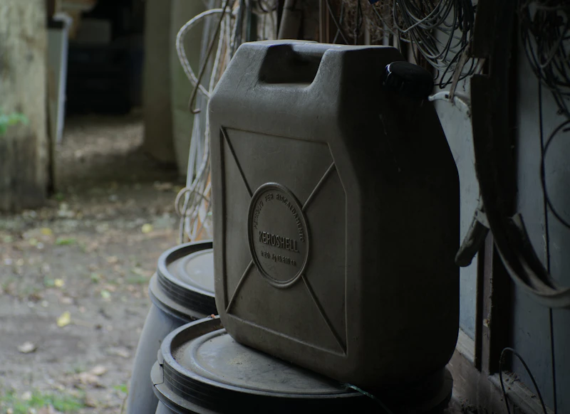 Black and grey industrial plastic fuel container
