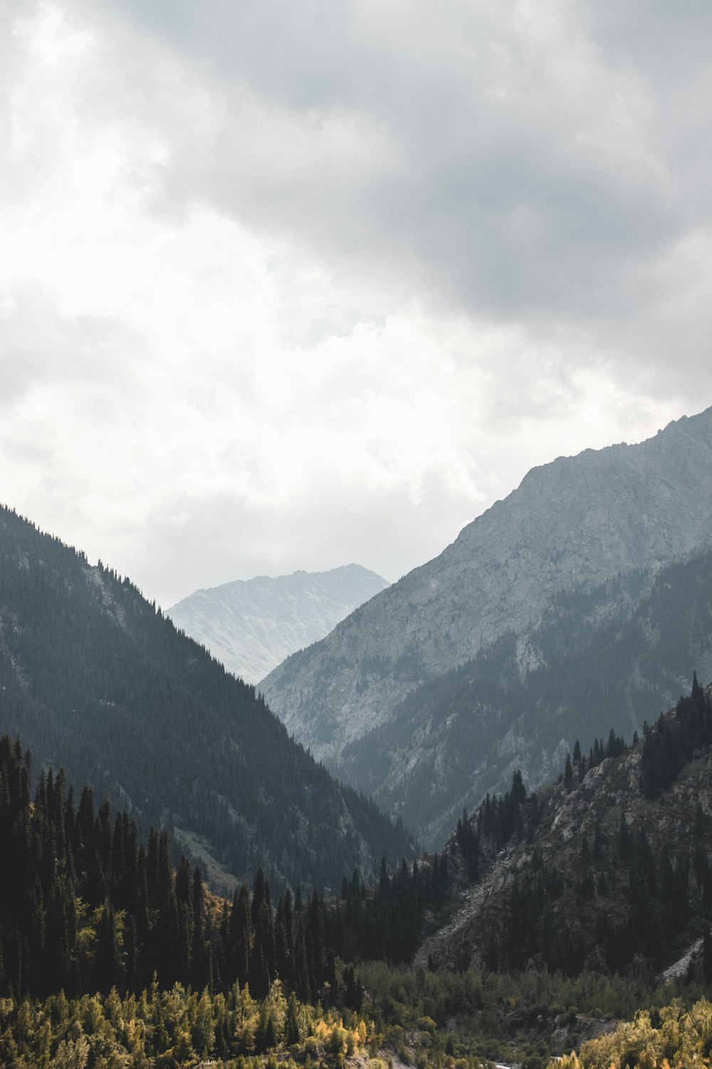 green mountains under white clouds during daytime