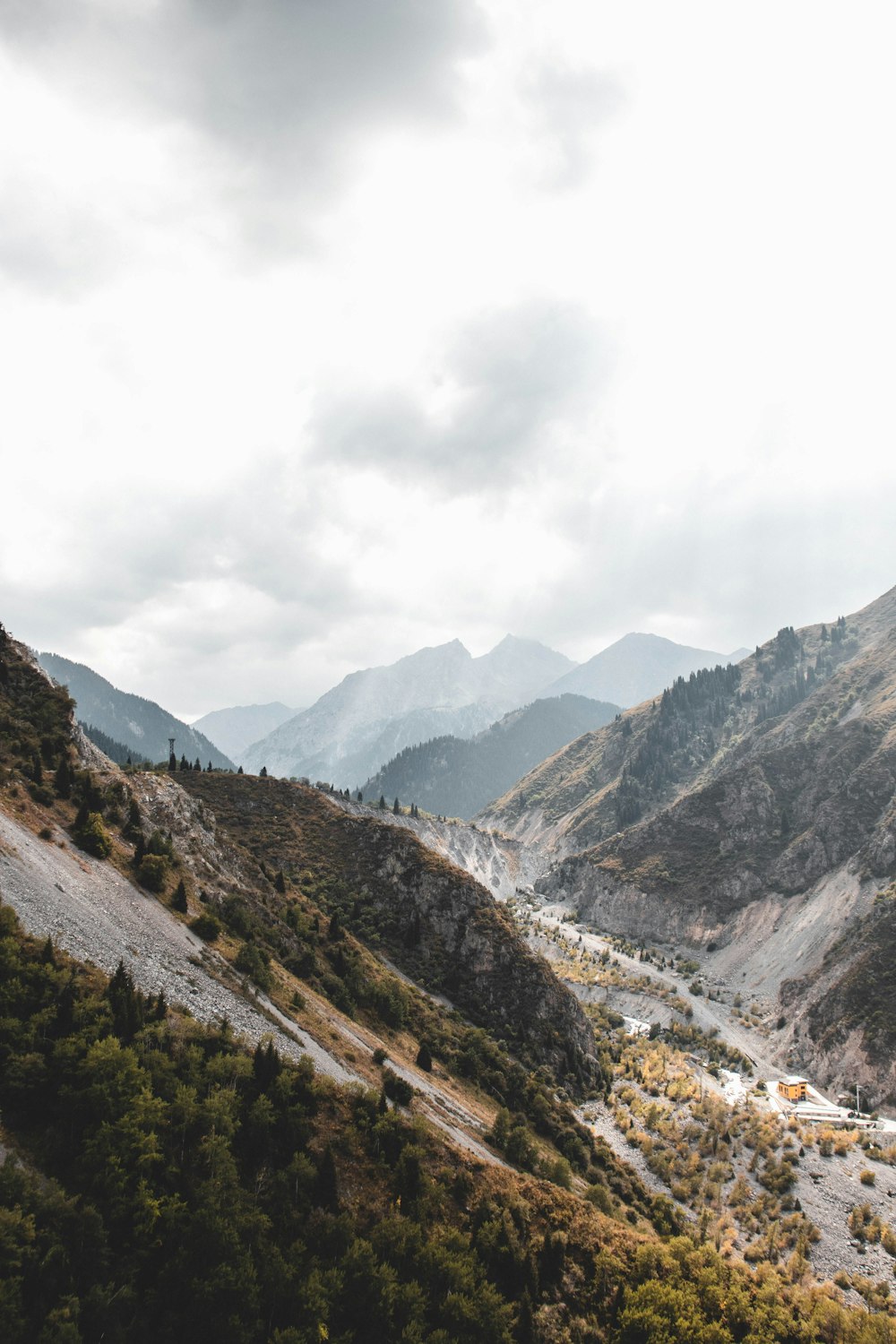 green and brown mountains under white clouds during daytime