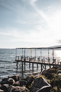 brown wooden dock on sea during daytime
