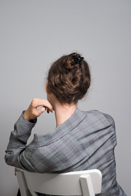 woman in gray and black stripe long sleeve shirt