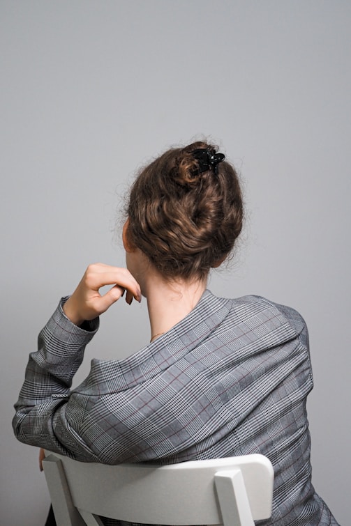 woman in gray and black stripe long sleeve shirt