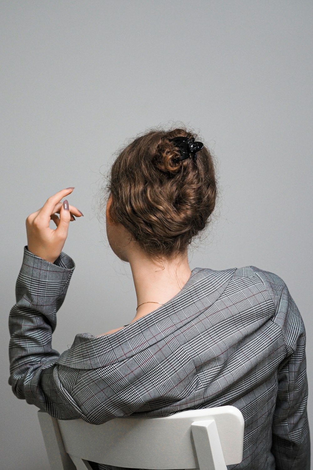 woman in gray and white striped long sleeve shirt