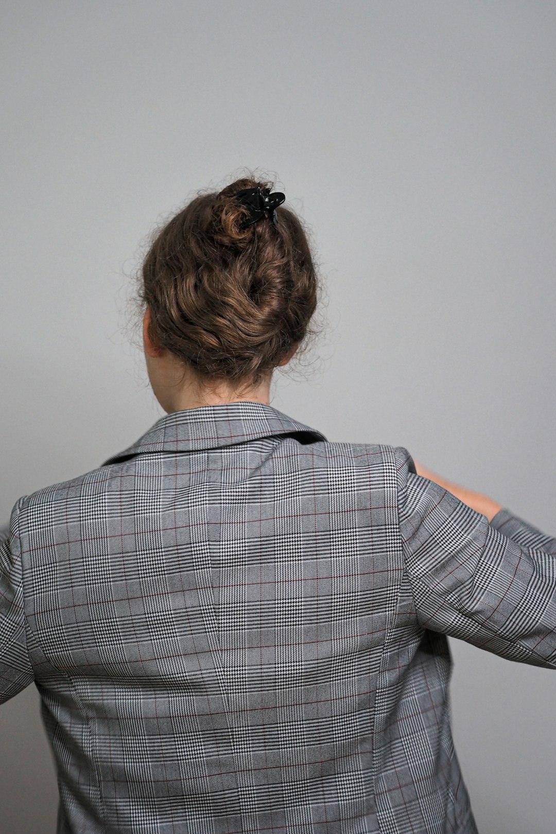 woman in black and white checkered long sleeve shirt