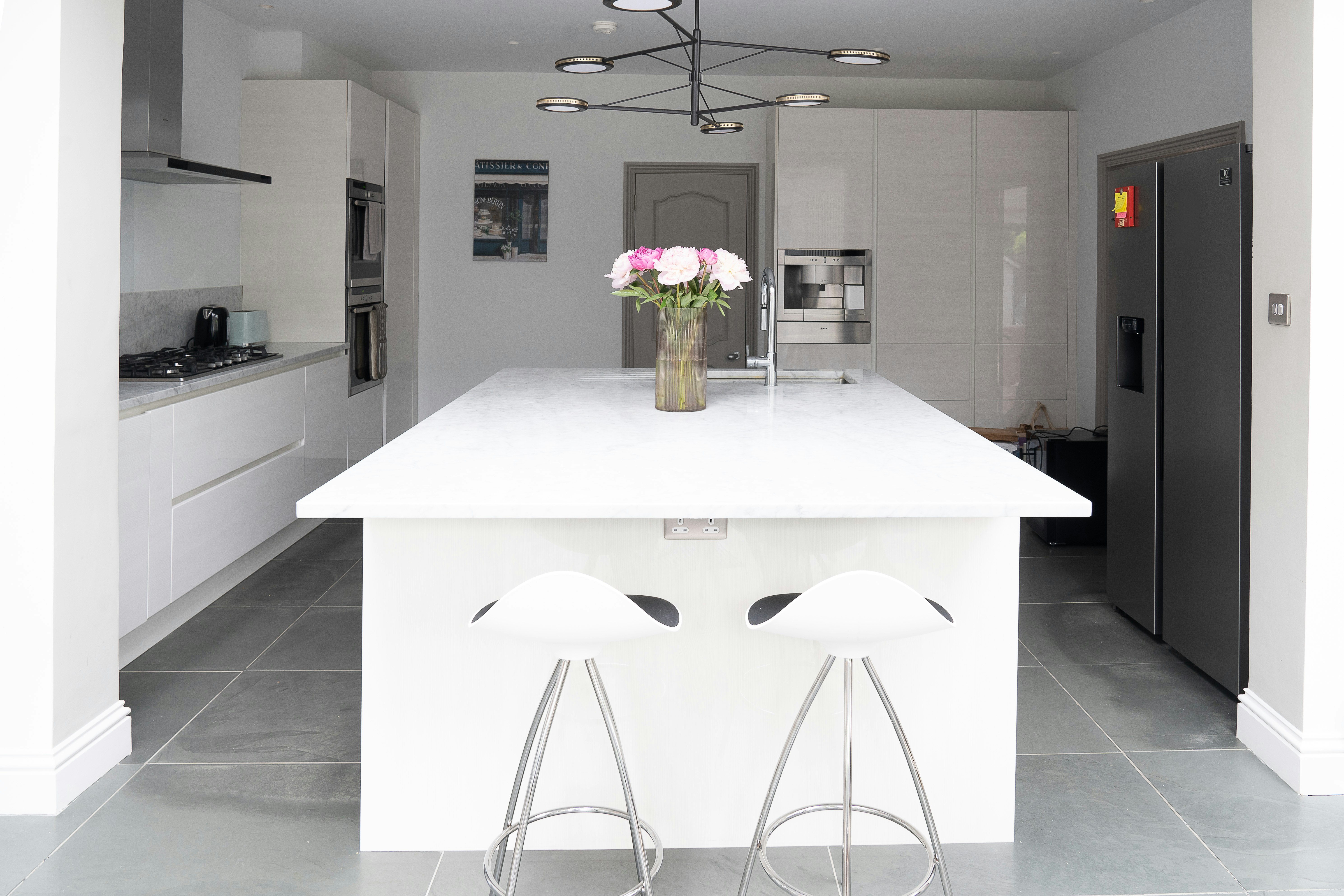 white wooden table with chairs