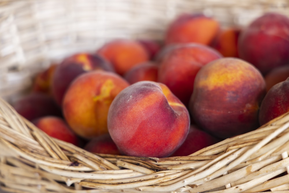 red apples on brown woven basket