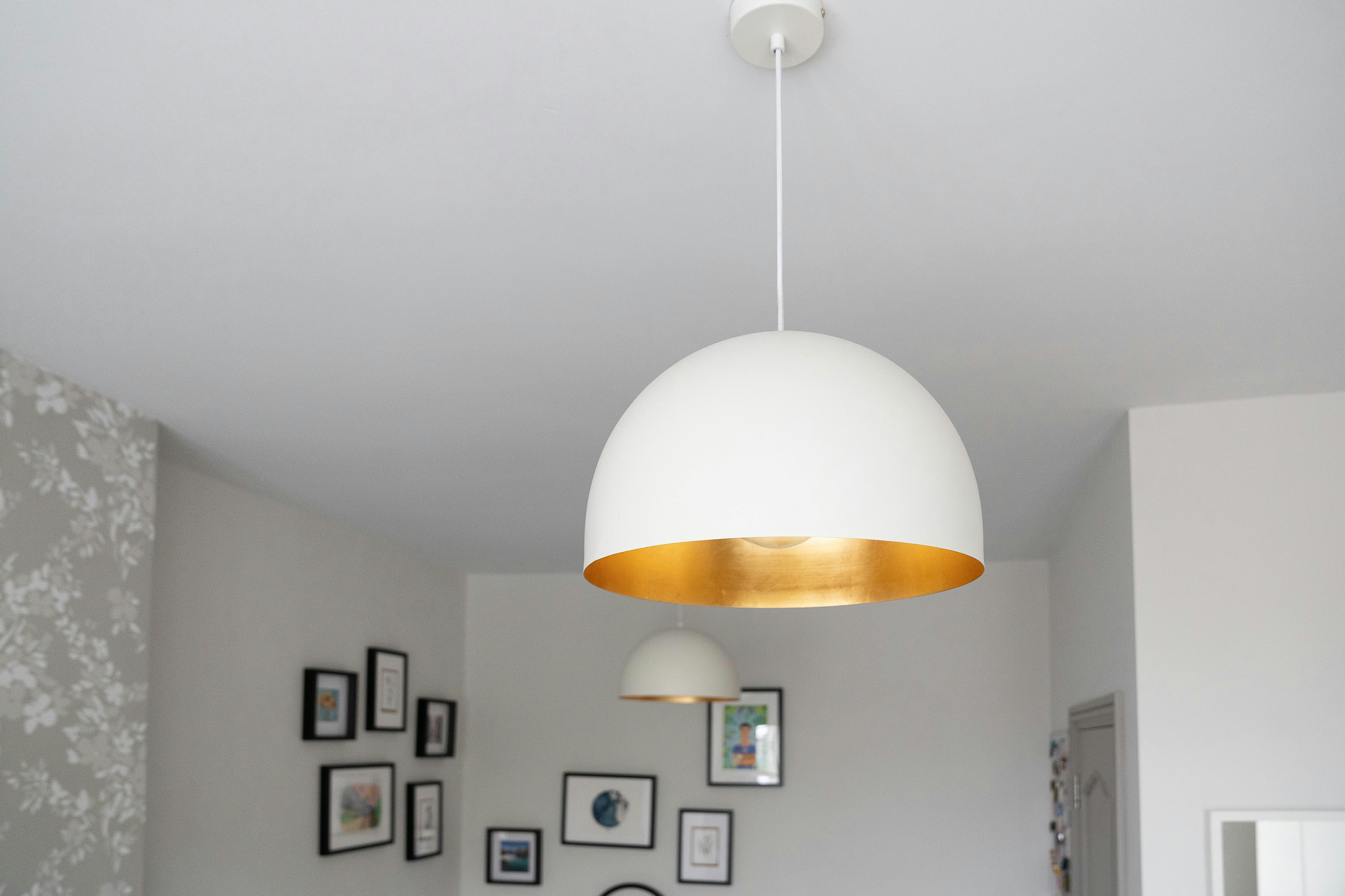 white pendant lamp turned on in room