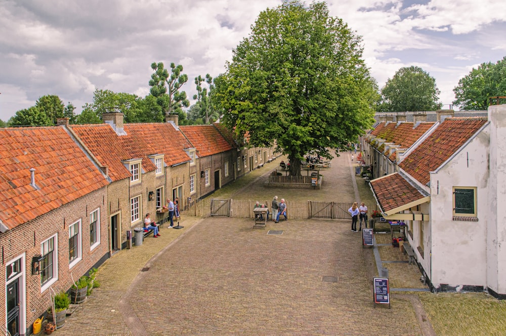 people walking on street near brown brick building during daytime