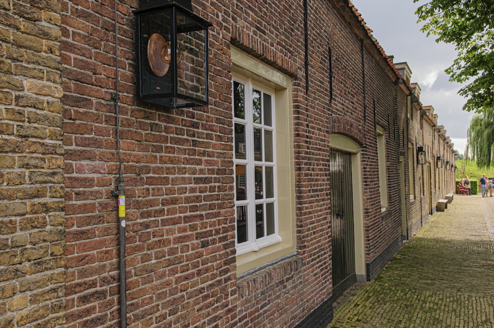 brown brick building with white wooden door