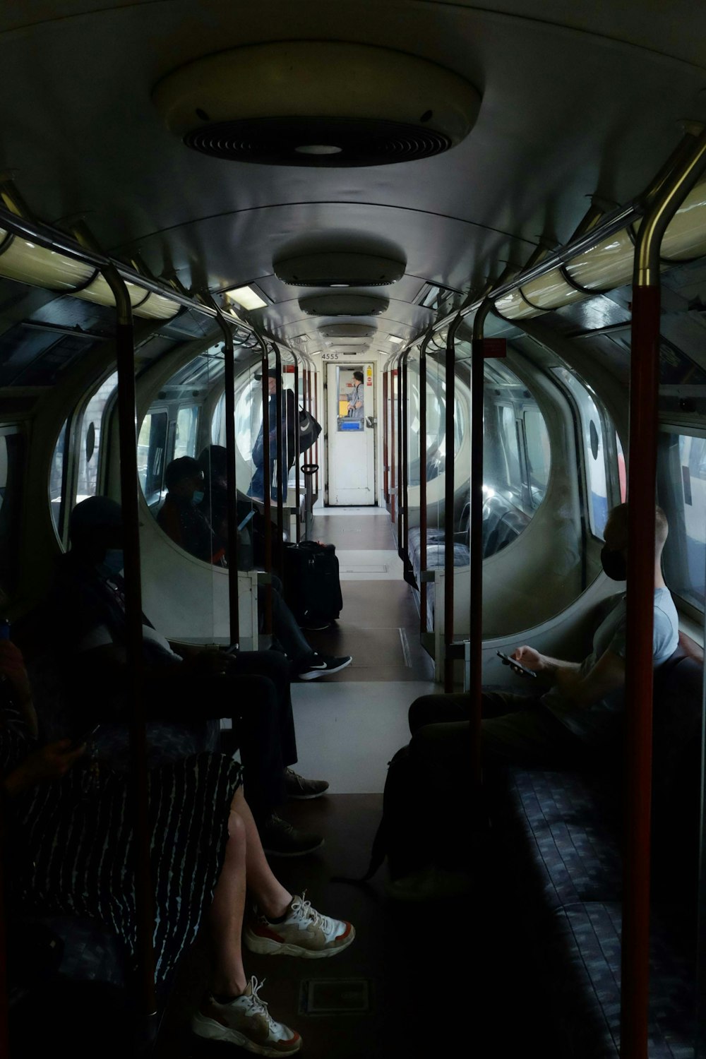 people sitting on train seat