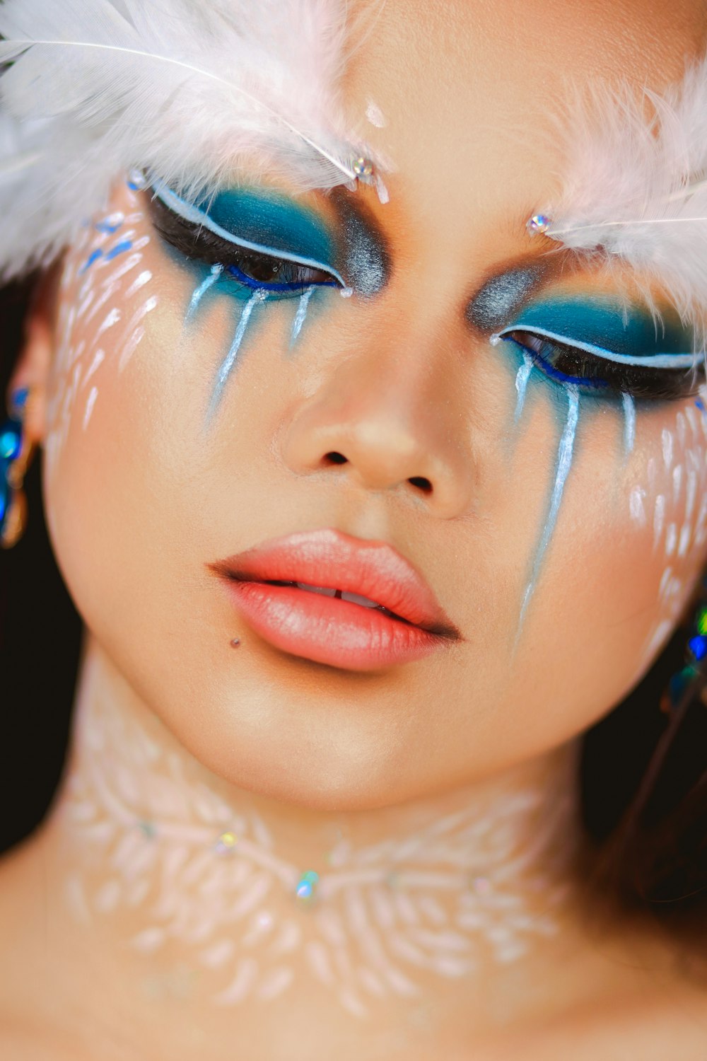 woman with blue and white face paint