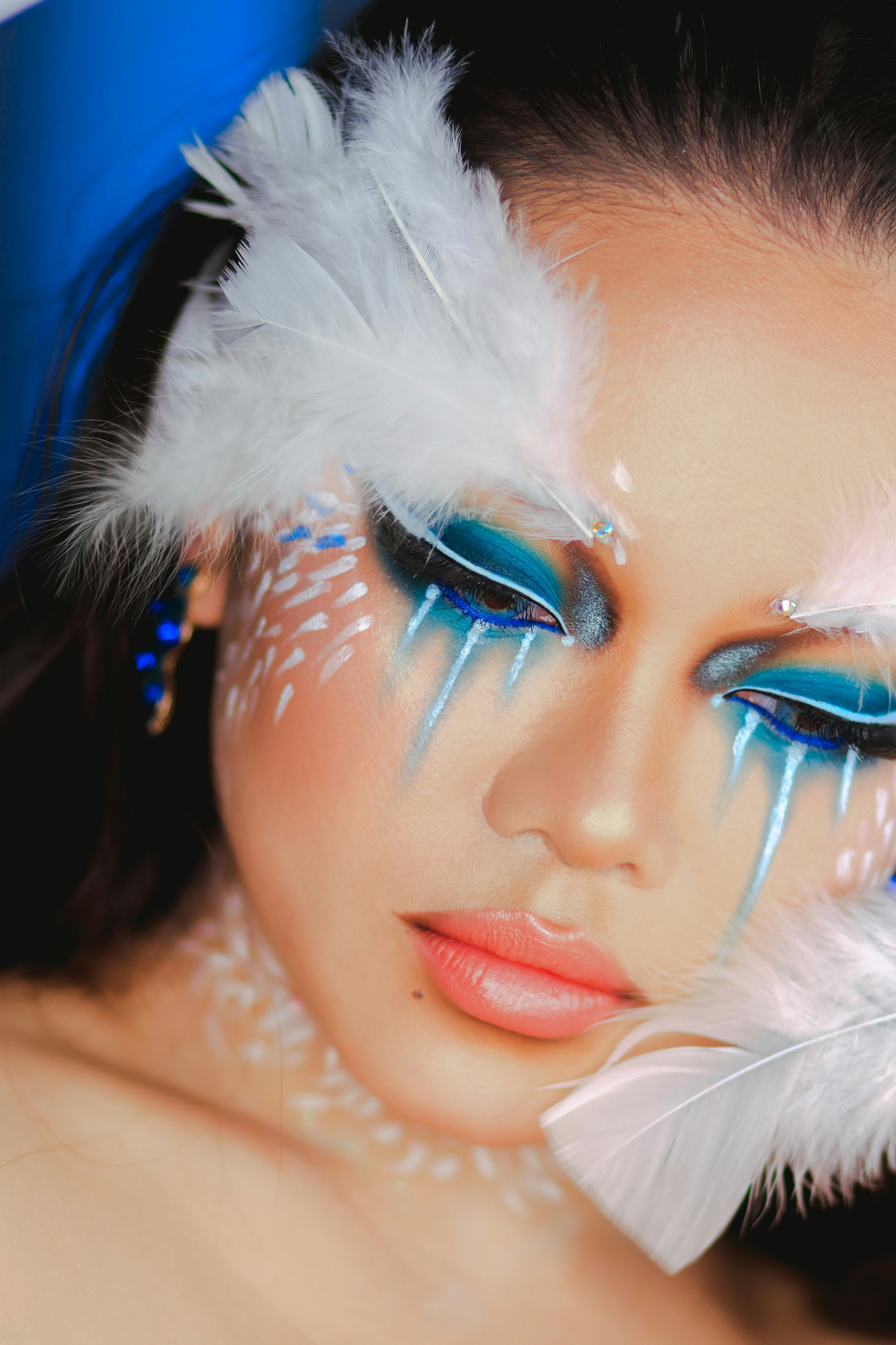 woman with blue eyes wearing white fur hat