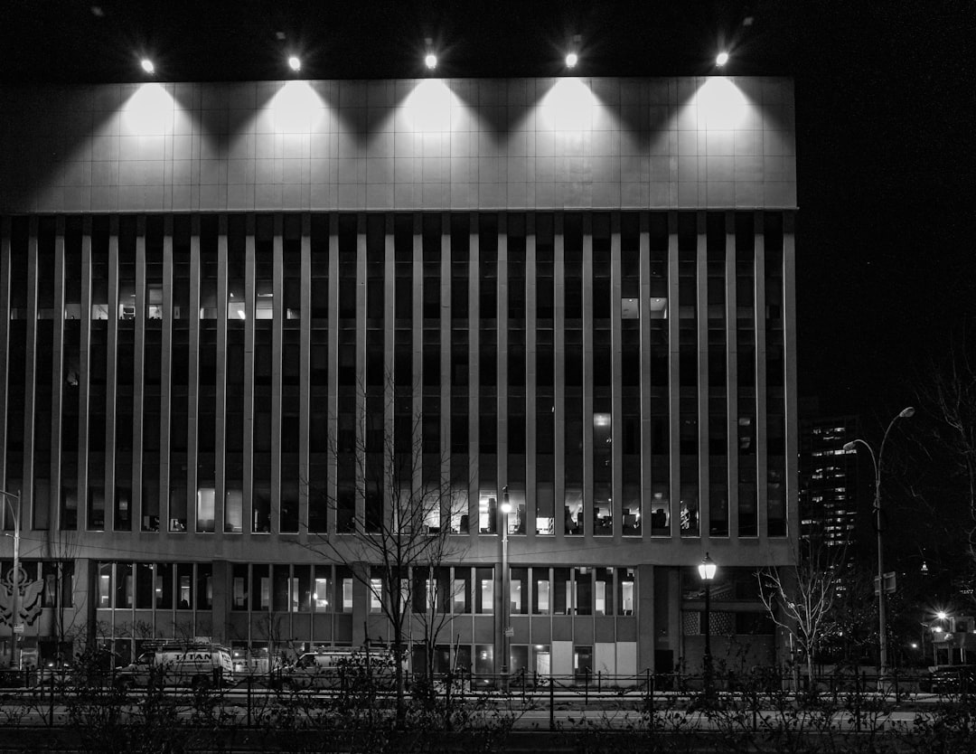 grayscale photo of building during night time