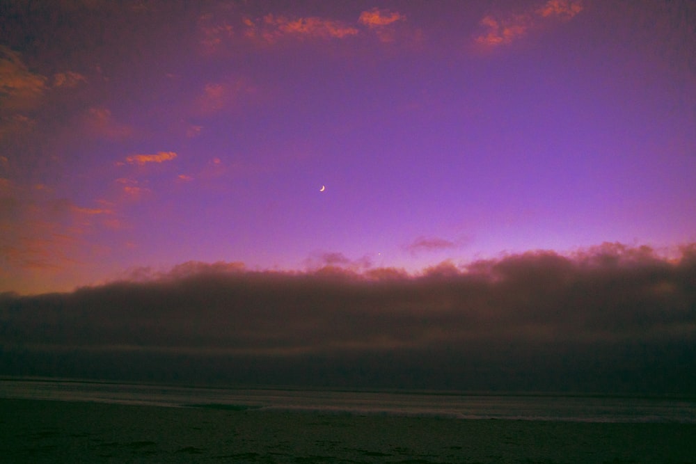 body of water under cloudy sky during daytime