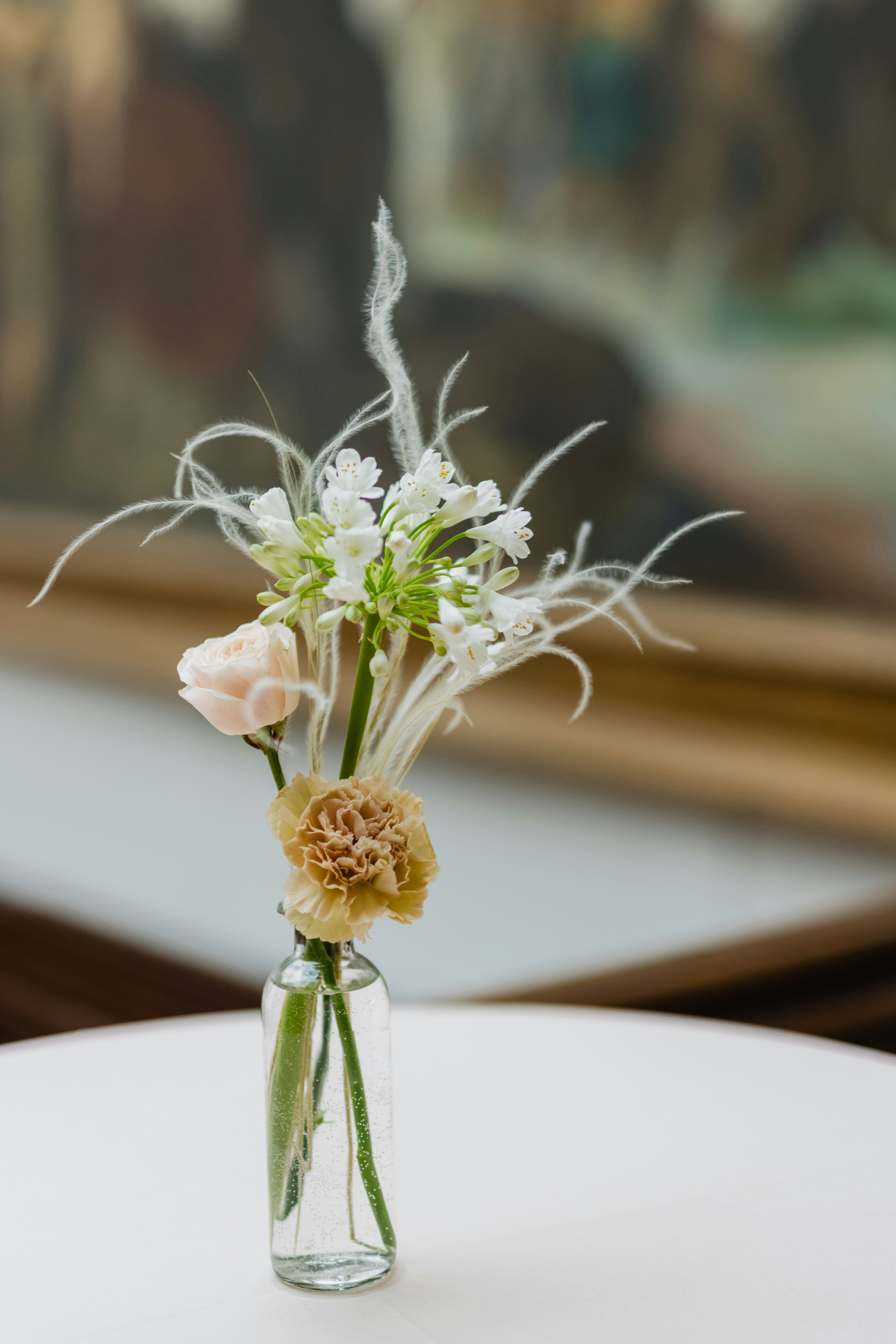 white flowers on white ceramic vase