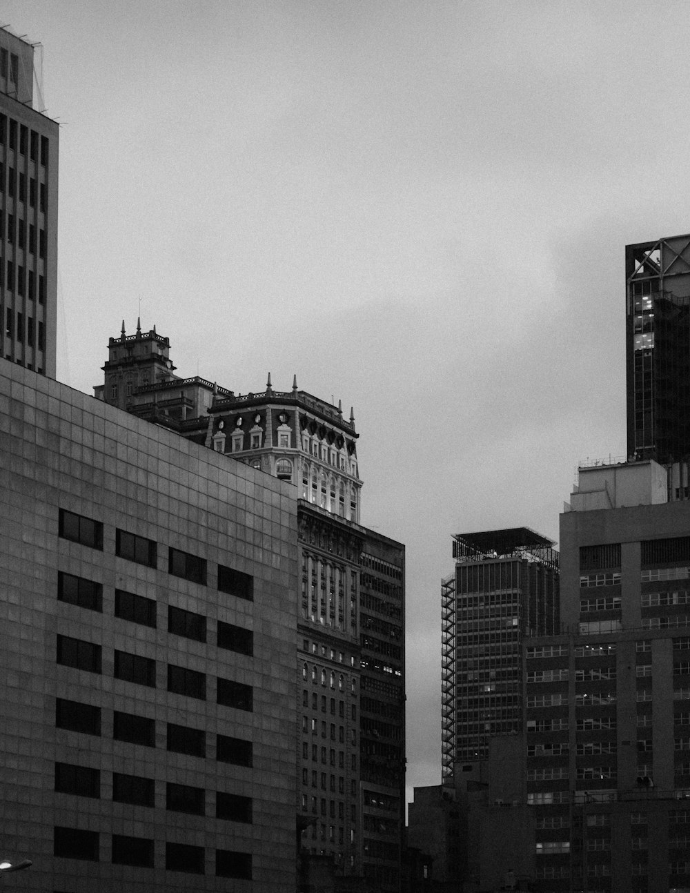 grayscale photo of high rise buildings