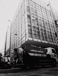 Photo showing Soldplast's modern waste collection truck parked on a clean city street in Peru.