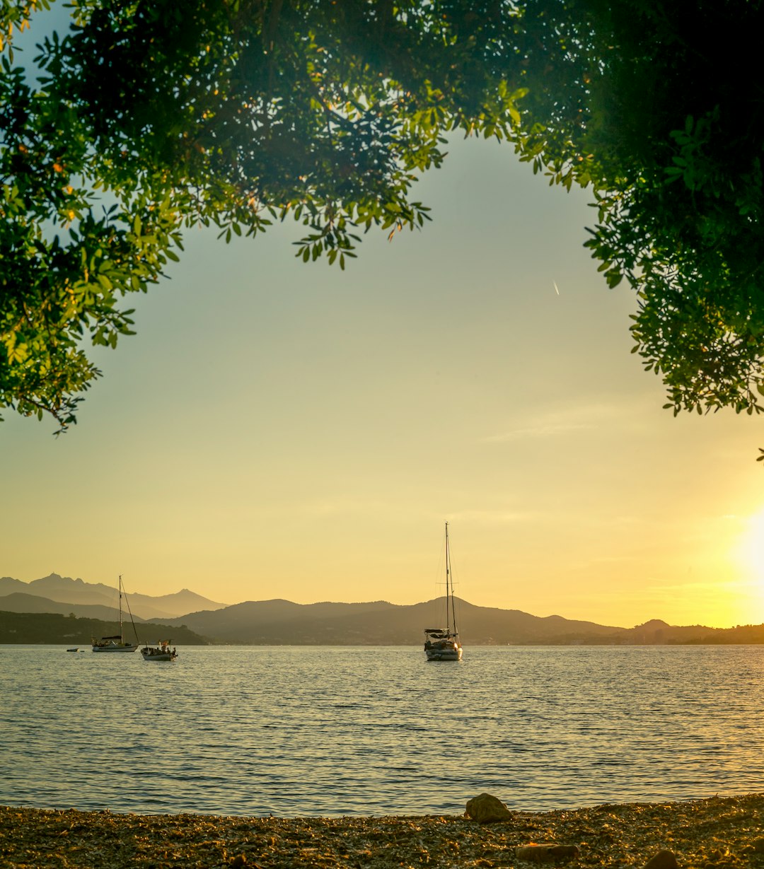 boat on sea during sunset