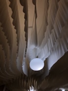 Elegant fabric drapes hanging perfectly aligned with load-rated hardware in a modern living room.