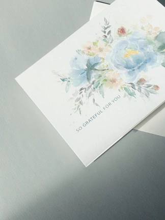 A cheerful thank you card with hand-drawn flowers.