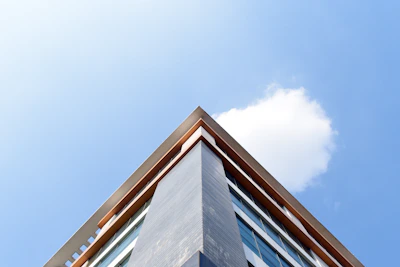 Sharp and clear photo of a modern real estate property exterior under blue sky.