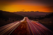 Sunset highway scene evoking open-road Americana with warm golden hues.
