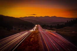Sunset highway scene evoking open-road Americana with warm golden hues.