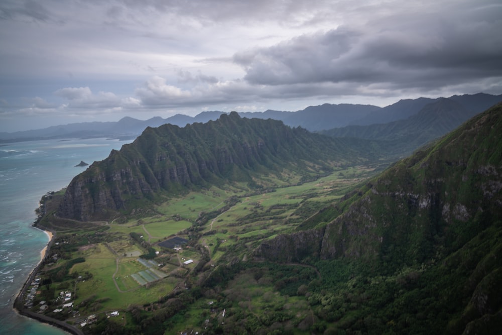 green mountains under white clouds during daytime