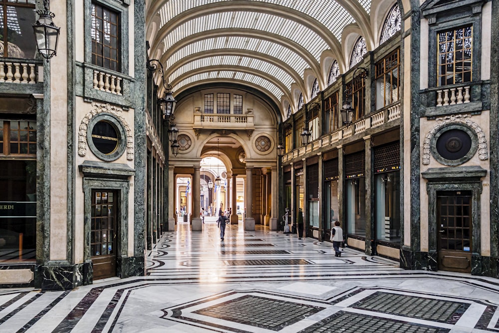 people walking on hallway of building