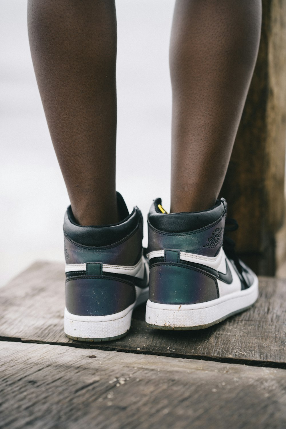 person wearing black and white high top sneakers photo – Free Sierra leone  Image on Unsplash
