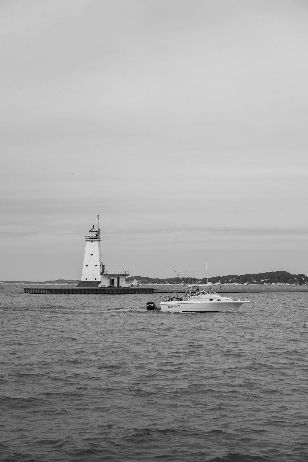 grayscale photo of a ship on the sea