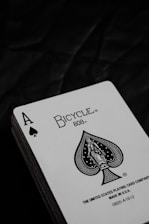 joker playing card on brown wooden table