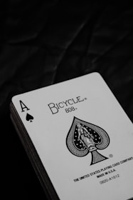 joker playing card on brown wooden table
