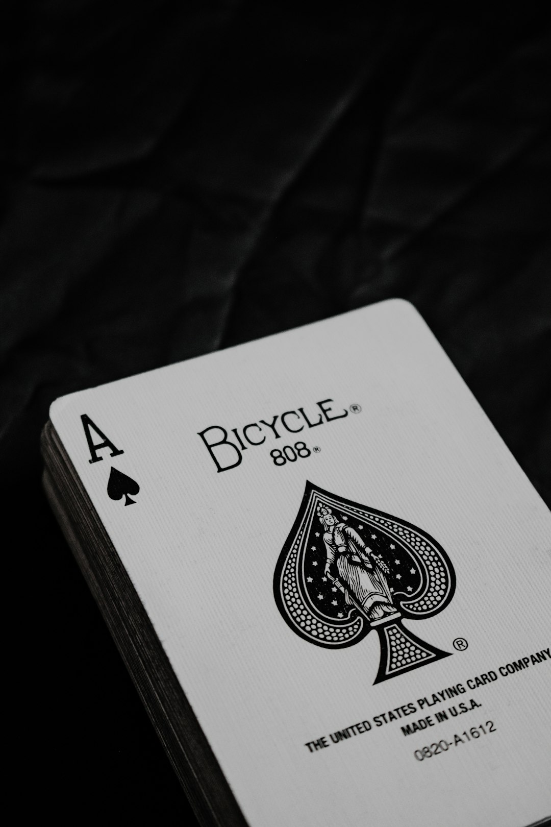 joker playing card on brown wooden table