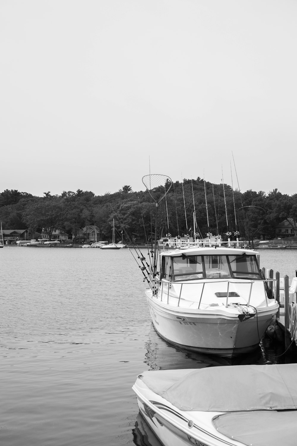 grayscale photo of boat on sea