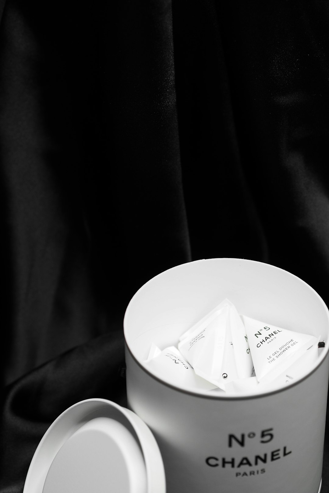 white plastic container on black textile