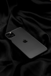 silver iphone 6 on black textile