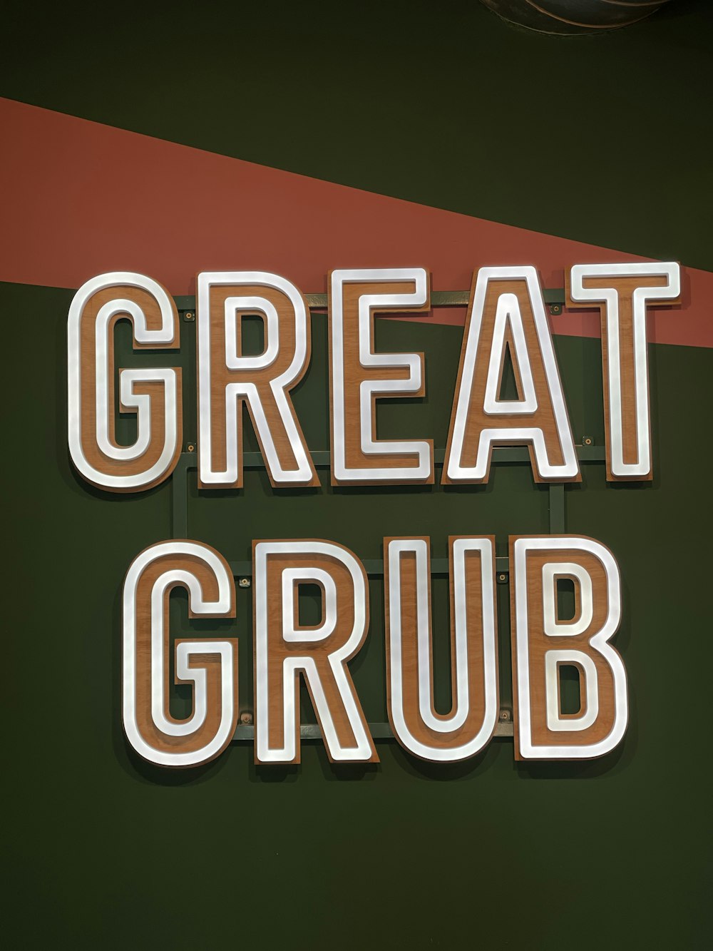 a sign that says great grub on the side of a building