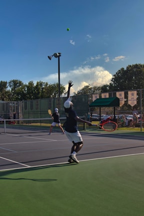 A tennis player hitting a powerful forehand during a sunny match