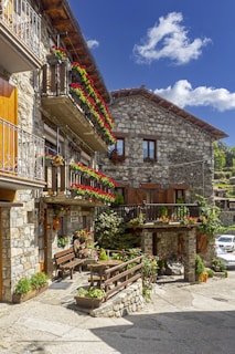 brown wooden bench near brown wooden table and chairs
